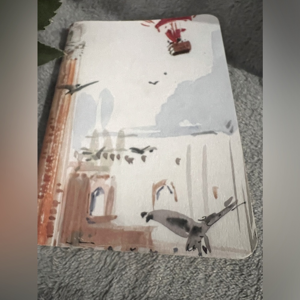 Louis Vuitton small notebook.